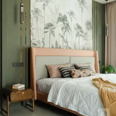 I believe a bedroom should be a personal sanctuary. Here, a stunning tropical wallpaper serves as an art piece, creating a serene backdrop for the custom-upholstered bed. The combination of soft textures, layered lighting, and bespoke furniture transforms this room into a tranquil escape.