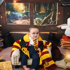 With his round glasses and Gryffindor scarf, this little one is the cutest wizard I've ever seen in the studio.