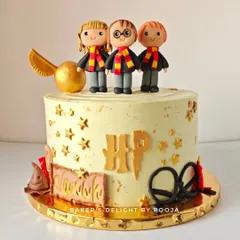 Turning ten is a magical milestone, especially with this Harry Potter themed cake. It features adorable, handcrafted fondant figures of Harry, Ron, and Hermione, along with a golden snitch and other wizarding world details.