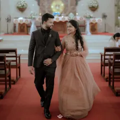 A couple walks down the aisle after their church wedding, sharing a happy glance. I capture both the solemnity and the joy of Christian ceremonies.