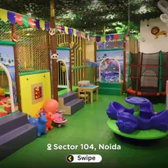 This photo gives a good sense of the layout, with the toddler-friendly rockers and merry-go-round in the foreground and the larger play structure behind.