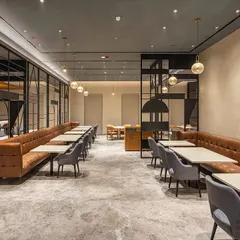 For the restaurant at Park Inn by Radisson in Jalandhar, we crafted a modern and inviting dining experience. The design uses clean lines, warm lighting, and a sophisticated material palette to create a contemporary restaurant ambiance that is both stylish and comfortable for guests.