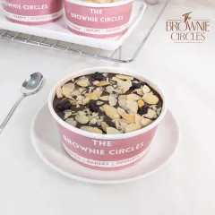 Our Almond Fudge Cake Tub is a nutty, chocolatey delight. We layer moist chocolate cake with a rich fudge sauce and top it with toasted almond flakes for a satisfying crunch.