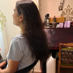 The 'before' shot, showing the long hair ready for donation.