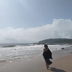 Walking along the shoreline. A breezy, comfortable outfit is essential for enjoying a long walk on the beach.