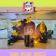 For the 50th anniversary of Paras Defence in MIDC Nerul, we created this celebratory photo corner right inside their office. The setup features custom backdrops and elegant black and gold balloon arrangements to mark the corporate milestone.