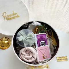 This Ramadan, I designed this special velvet gift hamper. It includes a hijab, a tasbeeh (prayer beads), a crescent moon necklace, and other thoughtful items.