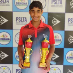 A double victory for Tavish at the U14 National Series in Jalandhar. He proudly displays his trophies for winning both the Singles and Doubles titles, showcasing his dominance in his age category.