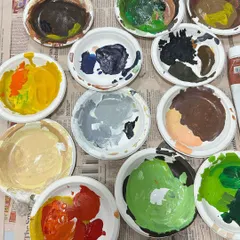 The beautiful mess of creation. Another look at my paint palettes, filled with the rich colors that brought the coffee-themed mural to life.