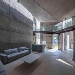 The interior of the 'House of Stories' in Bengaluru, a space designed for an author. We used raw, board-formed concrete not as a backdrop, but as a primary material, sculpting it to catch and hold light in ways that create moments of quiet and deep nuance.