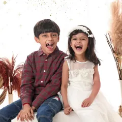 The pure, uninhibited joy of sibling laughter. My goal is to capture these real moments of connection that truly define your family's love.