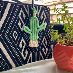 For something a little different, how about this cute macrame cactus charm? It's a fun and quirky accessory to personalize your keys or bag.