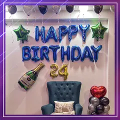A stylish and fun setup for a 24th birthday celebration. We used bold blue foil letters, star-shaped balloons, and a champagne bottle foil balloon to create a festive and celebratory vibe perfect for an adult's party.