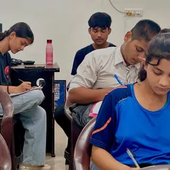 Here you can see the focus and dedication of my students. I provide one-on-one attention to make sure everyone understands the concepts, whether it's for Science, Commerce, or Arts subjects.