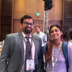 A candid moment with a junior colleague after a paper presentation. Mentoring the next generation of dermatologists is something I am very passionate about.