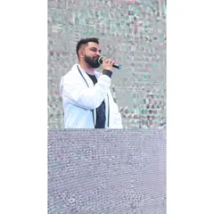Music is the universal language. Here I am on the mic, connecting with the crowd and letting the music do the talking.