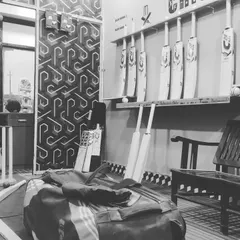 An inside look at our store setup. We have bats on display for you to try out and a large kit bag ready to be filled with all your essential gear.