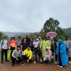 Our trekking group at the start of the Kurinjal trail inside Kudremukh National Park. Everyone is geared up with raincoats and ready for a misty, monsoon adventure.