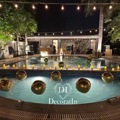 For a fabulous 40th birthday, we transformed this poolside into a chic, modern oasis. The combination of string lights, floating golden orbs, and warm candle lighting created an unforgettable ambiance for an adult celebration.