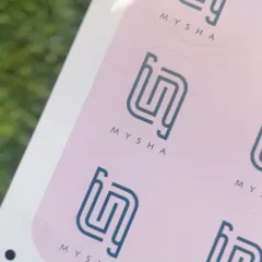 A close-up of the circular logo stickers designed for Mysha. Stickers are a versatile and cost-effective way to brand everything from mailers and boxes to product tags.