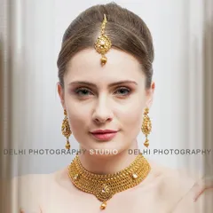 My jewelry photography focuses on capturing the fine details and true color of each piece. This close-up of a model wearing a traditional gold necklace set is perfect for product pages and promotional banners.