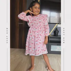 Dress your little angel in our pink cotton Christmas frock. The Santa print is adorable, and the white lace detailing and frill sleeves add an extra touch of sweetness.