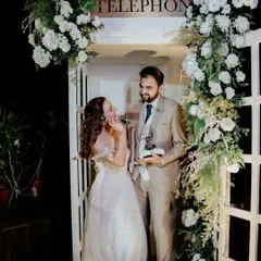 The couple enjoying their unique audio guestbook, a fun and interactive element for their wedding day.
