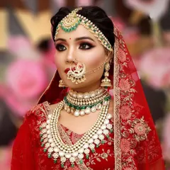 A complete bridal look featuring layers of pearl and Kundan necklaces, a delicate matha patti, and a traditional nath. Renting the full set ensures every element is perfectly coordinated.