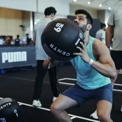 Performing a wall ball during the Hyrox competition. This exercise demands explosive power, muscular endurance, and cardiovascular capacity. Each rep is a reminder that consistent, structured training builds a body that is resilient and capable.