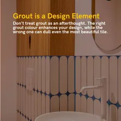 Grout is a critical design element, not an afterthought. The right grout color can enhance your tile design, like this blue grout that creates a stunning graphic pattern with white vertical tiles.