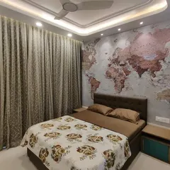 A closer view of the world map feature wall, showing the rich texture and detail that makes it the centerpiece of this bedroom. We paired it with earthy brown bedding and simple wooden side tables to maintain a cohesive and grounded aesthetic.