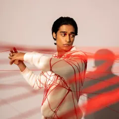 A conceptual men's grooming look for a fashion photoshoot. I kept the makeup minimal and the hair sleek to work with the creative concept involving red thread.