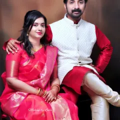 A couple dressed for an anniversary celebration. I gave the client a soft, romantic makeup look with loose curls to complement her beautiful pink saree.