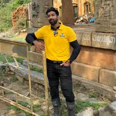 Standing at a historical site related to Kempegowda. The stone inscriptions and structures tell a story that's over 400 years old.
