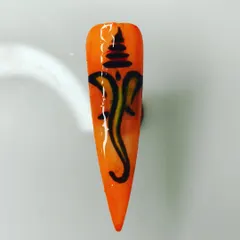 This nail shows a stylized Ganesha symbol, a beautiful example of free-hand brush control and line work that I cover in my classes.