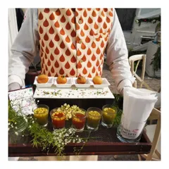 Our modern take on golgappas, presented on a custom tray with individual shot glasses of spicy and sweet water. This presentation is always a conversation starter and a highlight of our innovative Indian menu.