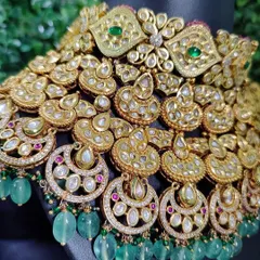 An incredibly detailed and heavy kundan and polki choker from my rental collection. The layers of crescent motifs and green bead drops create a look of pure opulence.