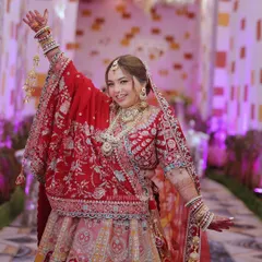 The bride's joyful and energetic dance, captured mid-motion with a big smile. This photo is all about celebrating the moment.