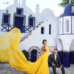 A splash of sunshine and joy. This vibrant shot, with its stunning yellow gown and Santorini-inspired architecture, shows how we can create a fun, destination-style shoot full of energy and romance.