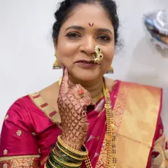 A playful pose from the groom's mother. She is glowing with happiness, and her makeup is designed to be elegant and age-appropriate.