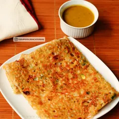 Our crispy Rava Dosa, made from semolina batter and folded neatly. It is served with a side of flavorful sambar, a popular choice for breakfast and tiffin services.