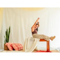A fun, unposed shot of a girl stretching happily on a bench during her studio session. We let kids be kids, and often these in-between moments make for the most memorable portraits.