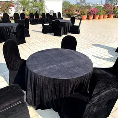 An elegant seating arrangement for a Diwali party on a terrace at Pali Hill. We used round tables with black velvet covers and matching chair covers for a chic and sophisticated look.