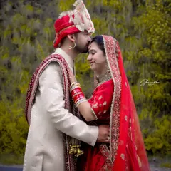 A tender moment from a Himachali wedding shoot. Capturing the quiet connection between a couple is what makes a wedding album special. This outdoor portrait highlights the beautiful traditional attire against a natural green background.