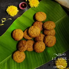 These are my savory Masala Biscuits, an eggless creation with a kick. They are flavored with shallots, garlic, and spices, making them an addictive snack.
