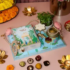 Our Gardenia Platter is a gift of indulgence and nature. It features a box of 12 assorted sweets, dry fruits, a candle, and a beautiful jade plant, all arranged on a reusable tray.
