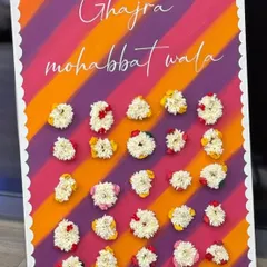 A beautiful "Ghajra mohabbat wala" board for a Sagan ceremony. Guests could pick a fresh gajra (floral bracelet) as a party favor, adding a lovely, fragrant, and traditional touch to the evening.