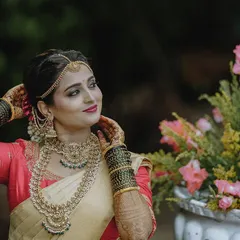 A beautiful candid portrait of a bride in her traditional wedding saree and jewellery. I love capturing these natural, in-between moments that show off the bride's personality and the elegance of her complete look.