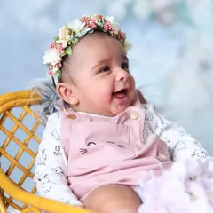 I absolutely adore capturing these moments of pure joy. This little one's bright, happy smile shows that my sessions are also about capturing the awake and expressive side of your baby's first few weeks.