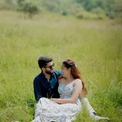 A candid moment of laughter and connection during a pre-wedding shoot in a sun-drenched field. My goal is to make you feel comfortable, so your real personalities shine through.